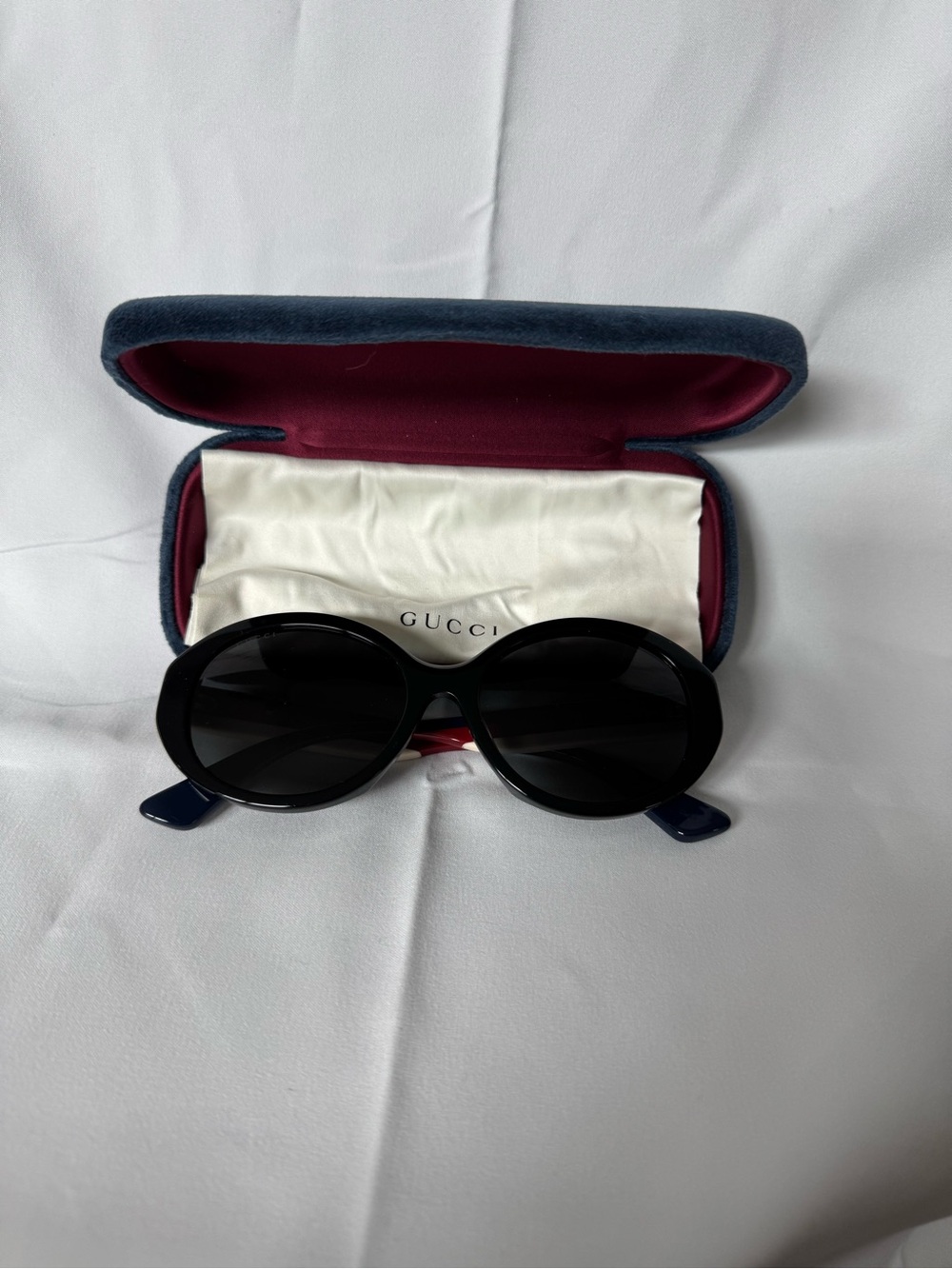 Gucci Black Oval Women's Sunglasses with Navy Temples